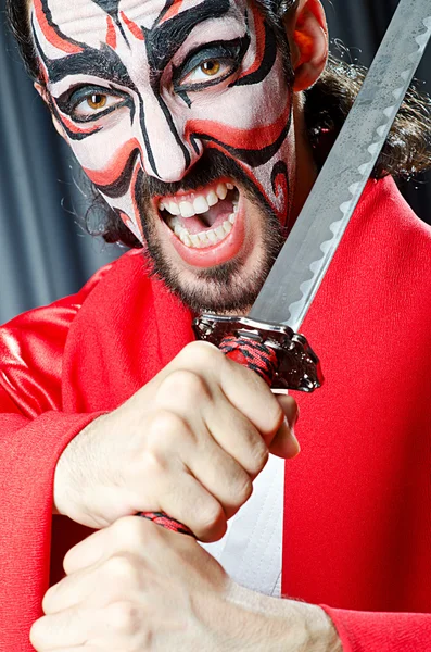 Człowiek z maska i miecz — Zdjęcie stockowe