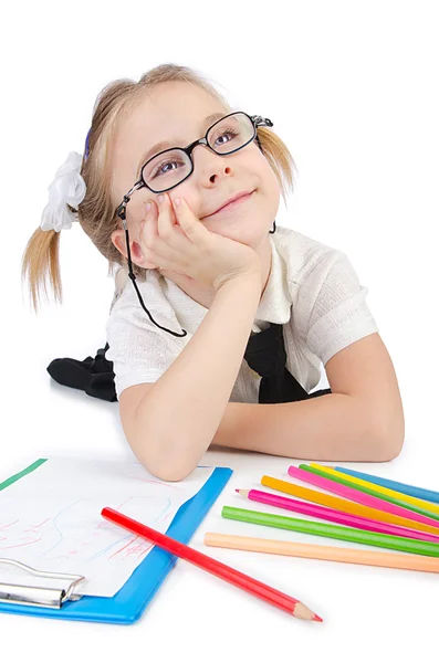 Klein meisje schrijven met potloden — Stockfoto
