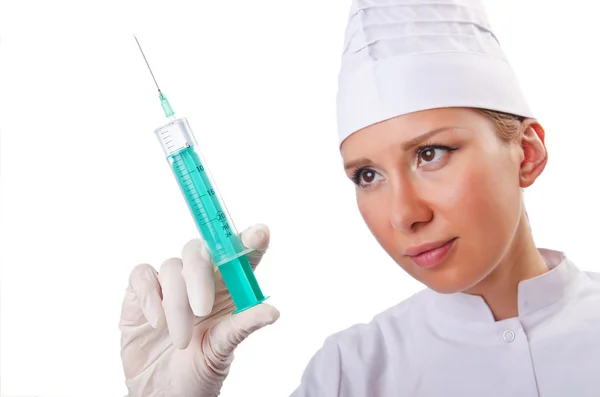 Woman doctor with syringe on white — Stock Photo, Image