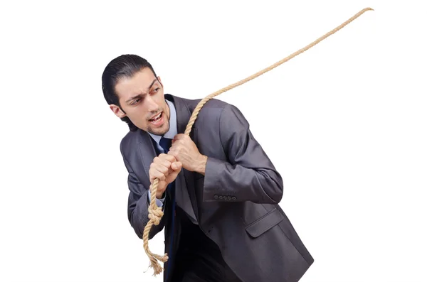 Бизнесмен тянет верёвку на белом — стоковое фото
