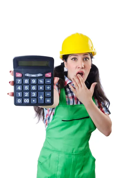 Женщина строитель с калькулятором на белом — стоковое фото