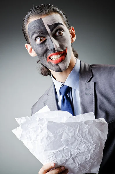 Biznesmen z malowanie twarzy klauna — Zdjęcie stockowe