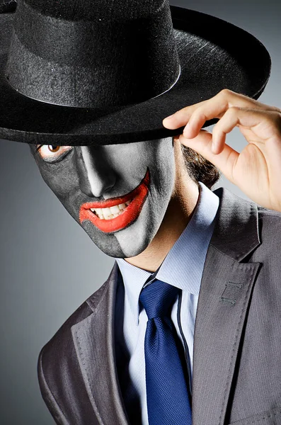 Бізнесмен з фарбою для обличчя клоуна — стокове фото