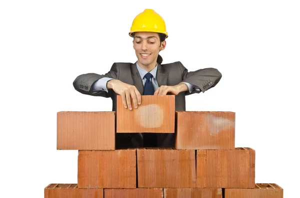 Businessman with bricks on white Stock Image