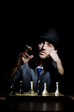 Chess player playing his game clipart