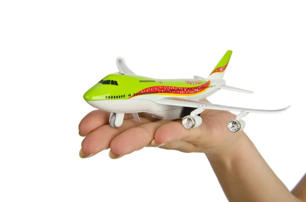 Χέρι που κρατά το παιχνίδι αεροπλάνο που απομονώνονται σε λευκό — Φωτογραφία Αρχείου