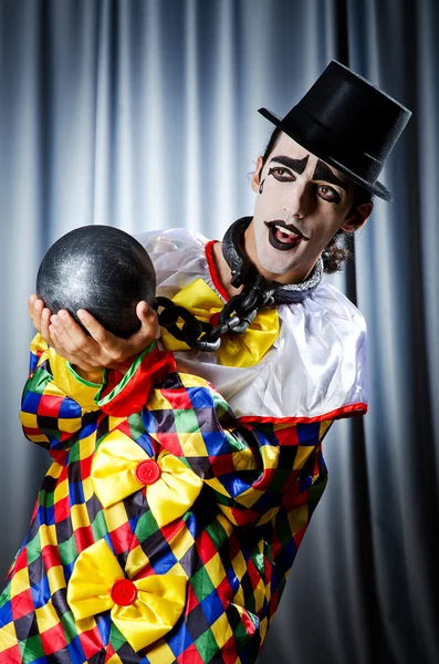 Clown with shackles in studio — Stock Photo, Image