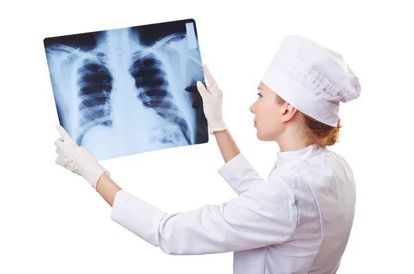 Woman doctor examining x-ray on white — Stock Photo, Image