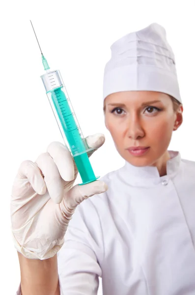 Kobieta lekarz ze strzykawką na białym — Zdjęcie stockowe