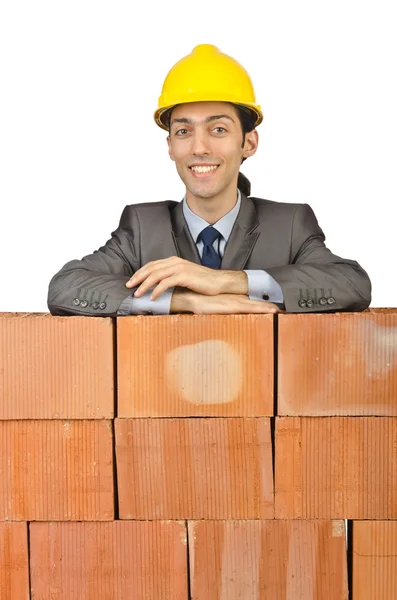 Businessman with bricks on white — Zdjęcie stockowe