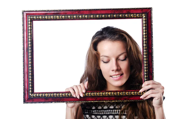 Mladá žena s rámečkem na obrázek na bílém pozadí — Stock fotografie