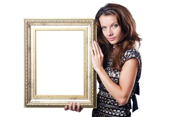 Ung kvinna med fotoram på vit — Stockfoto