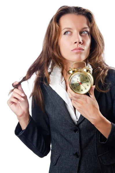 Businesswoman with alarm clock on white — Stock Photo, Image