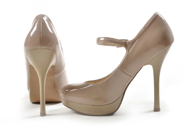 Kvinnliga skor på en vit bakgrund — Stockfoto