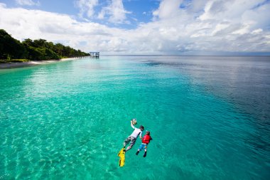 Father and son snorkeling clipart