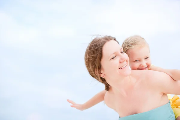 Mother and daughter having fun outdoors Stock Photo