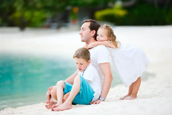 Father and kids on a beach — Stock Photo, Image