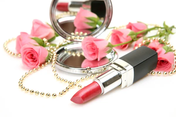 Pink roses and lipstick — Stock Photo, Image