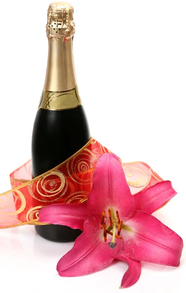 Wine and pink lily — Stock Photo, Image
