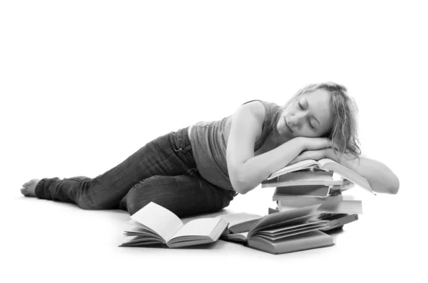 Young woman sleeping on stack of books — Stock Photo, Image