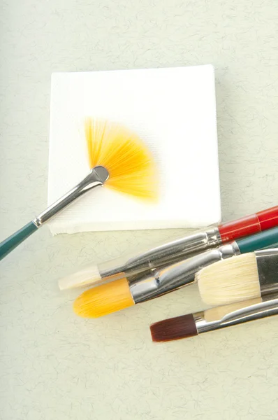 Brushes and stiker — Stock Photo, Image