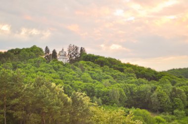 Old Orthodox church on the top of the mountain clipart