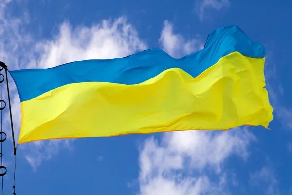 stock image Ukrainian flag waving on cloudy sky