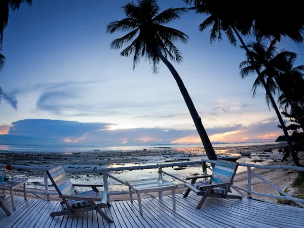 Cafe outdoor with terrace on sunset beach — Stok fotoğraf