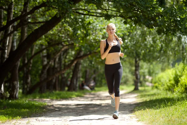Running woman in park — Stock Photo, Image