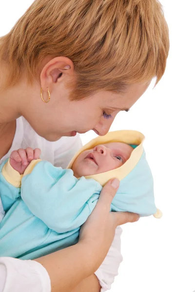 Young woman kisses her newborn baby — Stock Photo, Image