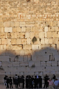 A large group of religious Jews and secular three men near the clipart