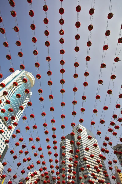 Traditional red lanterns and the skyscrapers — Stock Photo, Image