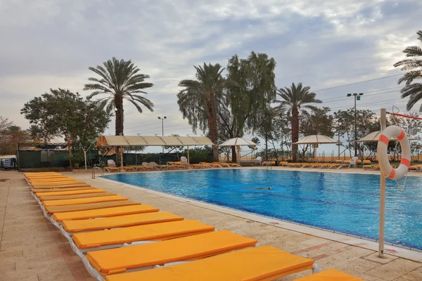 stock image The swimming pool and beach loungers