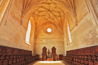 The magnificent chapel with a rows of oak chairs clipart