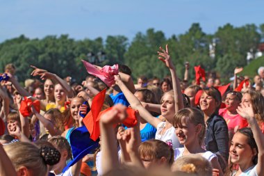 VELIKIJ NOVGOROD, RUSSIA - JUNE 10: Young girls dance on street clipart