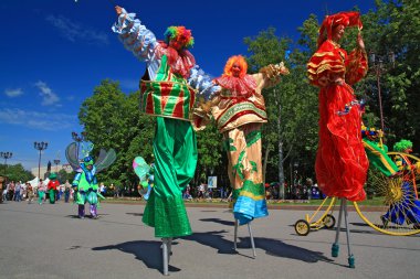 VELIKIJ NOVGOROD, RUSSIA - JUNE 10: clowns on town street at day clipart