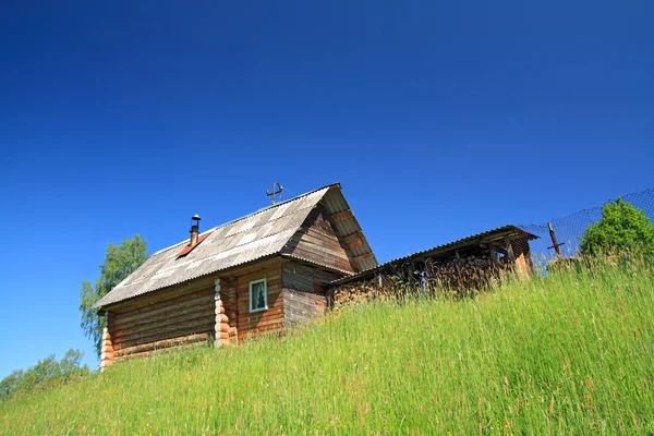 Rural house not low hill — Stock Photo, Image