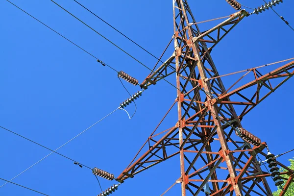 Electric pole on blue background — Stock Photo, Image