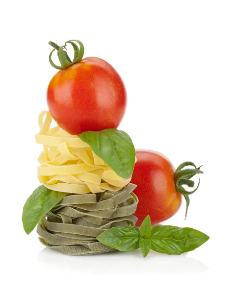Fettuccine nest pasta with tomato cherry and basil — Stock Photo, Image