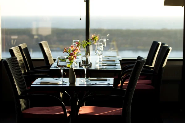 stock image Modern restaurant interior with scenic seaside view