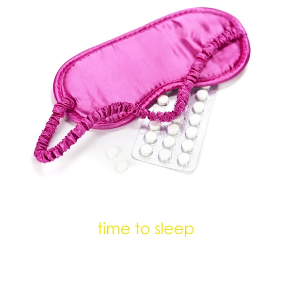 Sleeping mask and pills — Stock Photo, Image