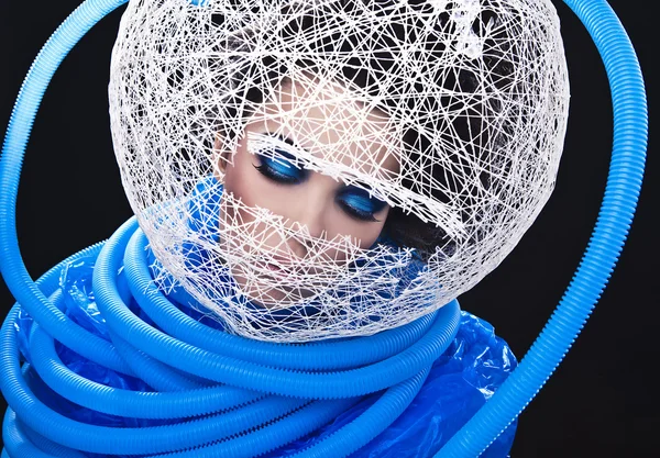 Futuristic beautiful young female face with blue fashion make-up. — Stock Photo, Image