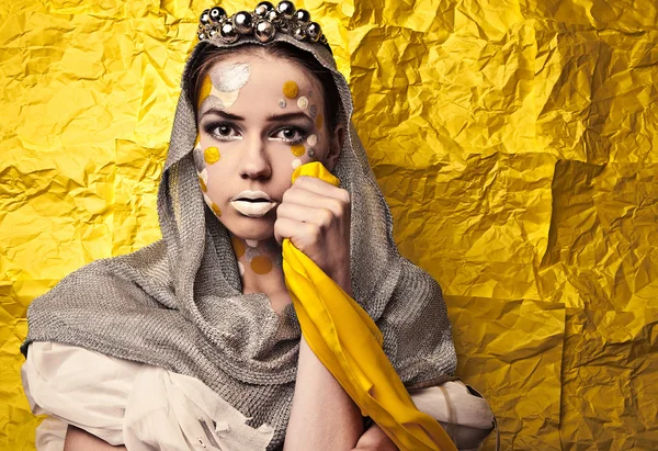 Fashion Beautiful Woman over grunge yellow background. — Stock Photo, Image