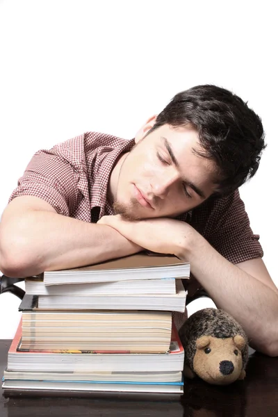 Tiener mannelijke slapen op boeken — Stockfoto