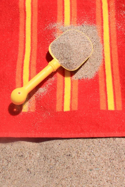 Beach sand on towel — Stock Photo, Image