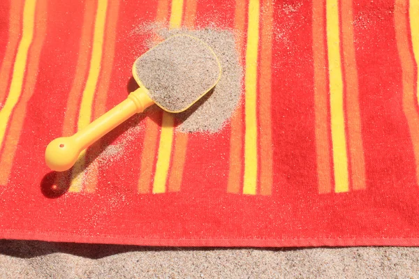 Beach sand on towel — Stock Photo, Image