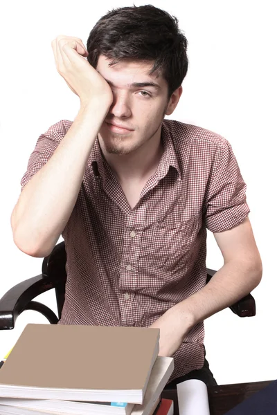 Tired male teen rubbing his eyes — Stock Photo, Image