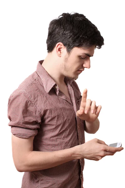Молодой человек держит мобильный телефон — стоковое фото