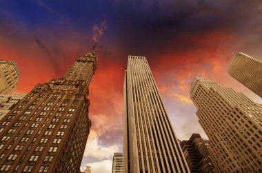 Clouds and dramatic sky above Modern Skyscrapers clipart