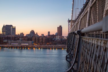 Manhattan Bridge at Sunset in New York City with City Skyline clipart